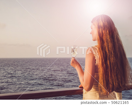 Cute woman holding a beautiful glass of champagne Cute woman holding a beautiful glass of champagne 50621165