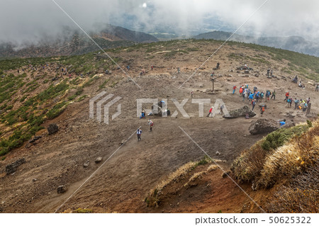 Mountain climber on Adaira mountain summit square Mountain climber on Adaira mountain summit square 50625322