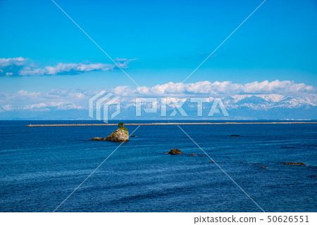 Amaharu Kaigan Man Rock and Tateyama Mountain Range 2010.04 a 50626551