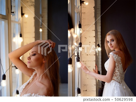 Portrait of a beautiful bride in a lace dress.Makeup smoky eyes, emphasis on eyes. Long flowing hair 50629598