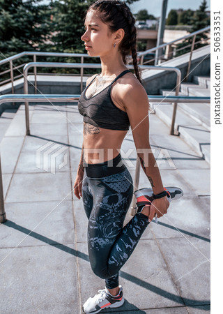 Woman athlete girl fitness workout, summer city day morning. Active lifestyle concept warming up Woman athlete girl fitness workout, summer city day morning. Active lifestyle concept warming up 50633351