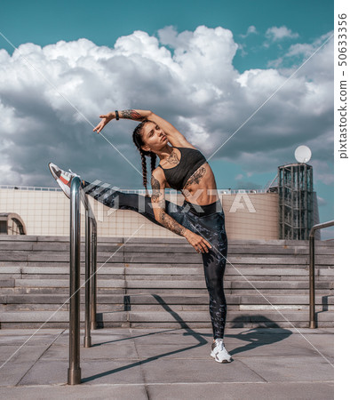 Woman athlete girl fitness workout, summer city day morning. Active lifestyle concept warming up Woman athlete girl fitness workout, summer city day morning. Active lifestyle concept warming up 50633356