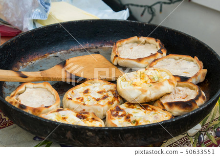Process of cooking hot pies with chicken and cheese 50633551