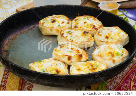 Process of cooking hot pies with chicken and cheese 50633554