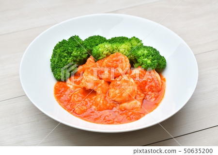 Stir-fried shrimp chili, shrimp chili, shrimp chili. Chinese food, spicy food, seafood food. Served with boiled broccoli 50635200