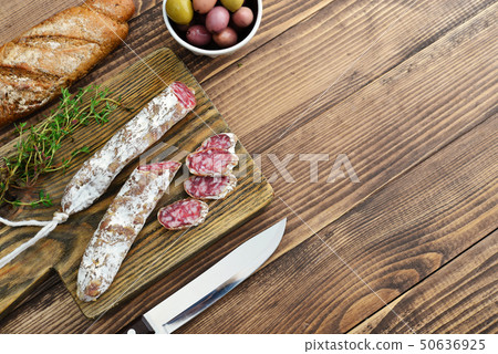 Spanish moldy salami on cutting board 50636925