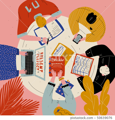 Top view of young people sitting at the table and learning English. Students studying together. 50639076