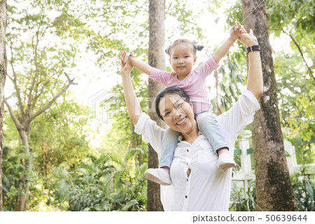Joyful mother and daughter in park 50639644
