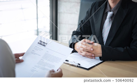 Employer arriving for a job interview, businessman 50640092