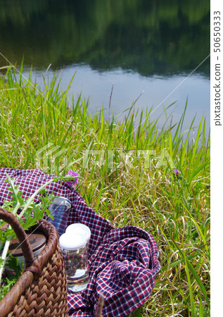 Cup sake on the shore of the pond Cup sake on the shore of the pond 50650333