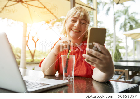 Woman with lemonade making videocxall Woman with lemonade making videocxall 50653357