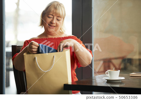 Mature woman after shopping 50653386