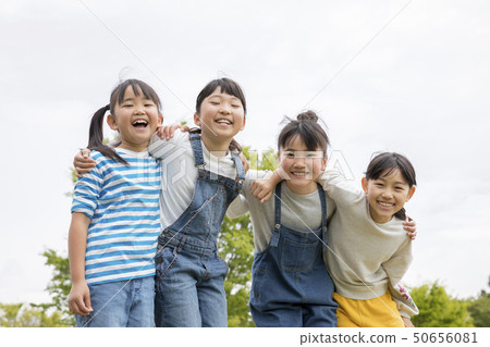 Laughing children with their shoulders 50656081
