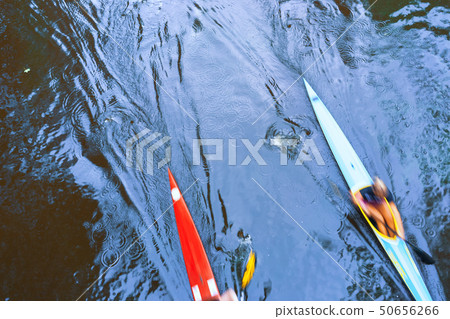 Two kayaks on the water with reflection 50656266