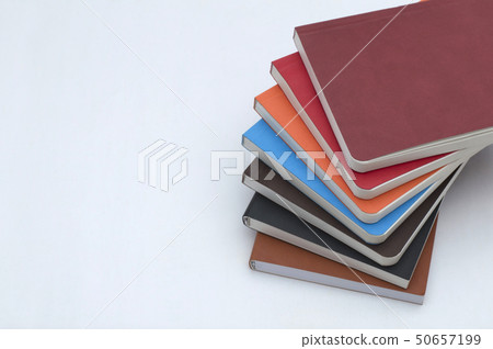 Stack of diary planers on white background 50657199