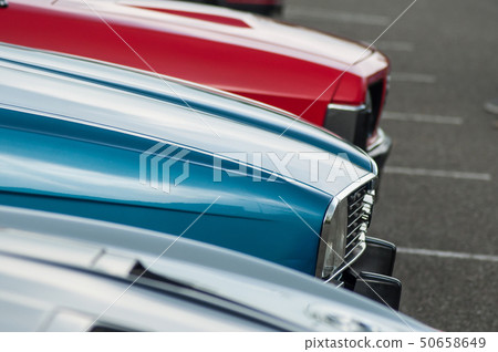 vintage cars alignment parked in the street 50658649