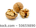 Walnuts, whole and opened on white background 50659890