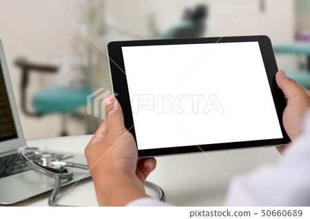 Dentist dental tool to teeth x-ray work Looking At 50660689