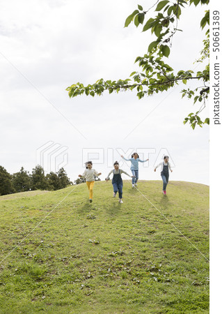 Children running down the hill 50661389