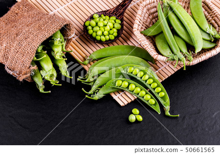 Sugar snap peas with mint on a rustic wood 50661565