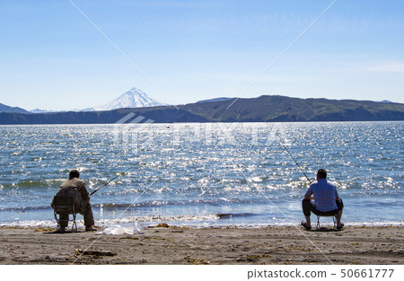The fisherman sitting and fishing on the beach of 50661777