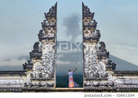 Man is standing in the gate of Lempuyang temple Man is standing in the gate of Lempuyang temple 50661894