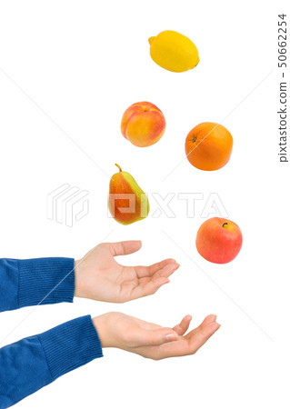 Juggling hands and fruits 50662254