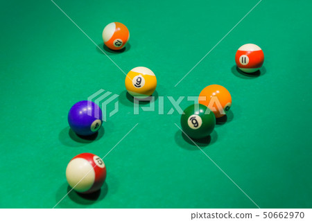 Billiard balls on pool green table 50662970