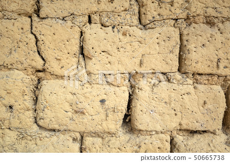 old yellow mud brick wall background old yellow mud brick wall background 50665738