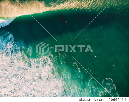 Aerial shooting of surfing at sunset. Aerial shooting of surfing at sunset. 50666414