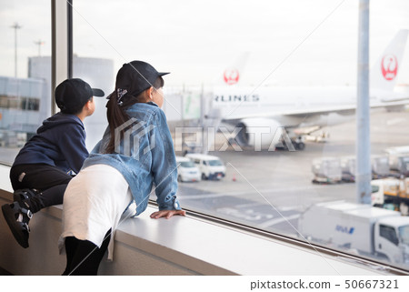 Kid watching the plane Kid watching the plane 50667321