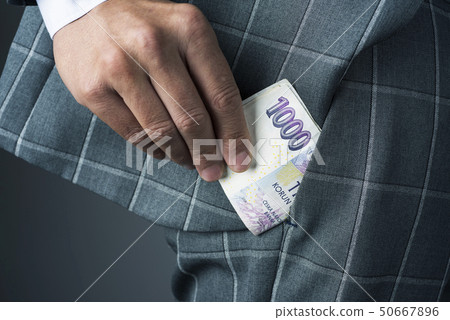businessman with czech korunas banknotes 50667896