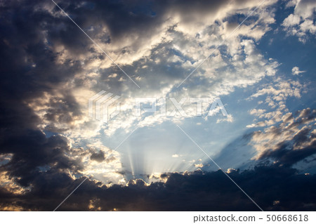 Cloudscape with the sun rays radiating from behind Cloudscape with the sun rays radiating from behind 50668618
