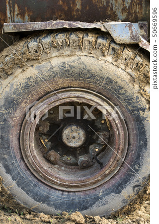 Muddy wheels of the big truck. Muddy wheels of the big truck. 50669596