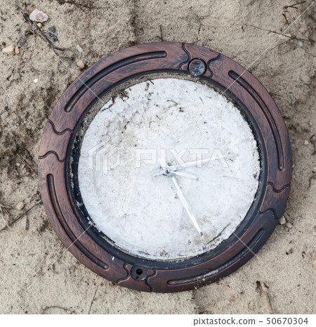 Broken clock without numerals on the clock face Broken clock without numerals on the clock face 50670304