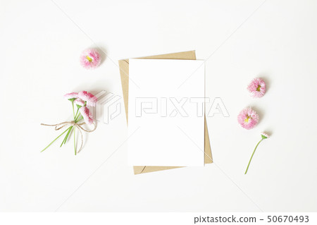 Feminine stationery, desktop mock-up scene. Vertical blank greeting card, craft paper envelope and 50670493