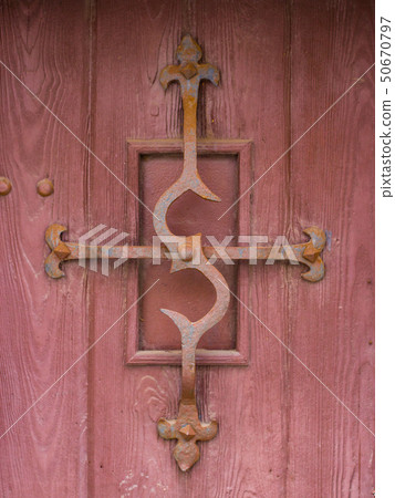 old brown wooden door with antique details 50670797