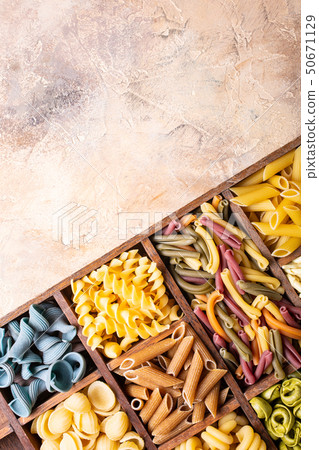 Assorted colorful italian pasta in wooden box Assorted colorful italian pasta in wooden box 50671129