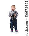 three-year boy with a camera in hand in the 50672691