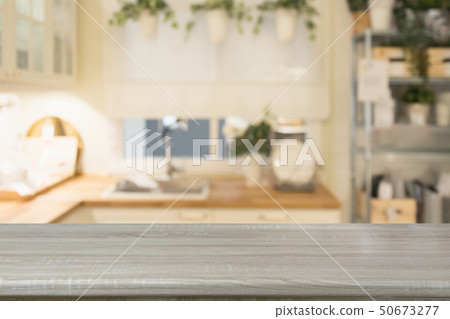 Blurred kitchen background with wooden tabletop. 50673277