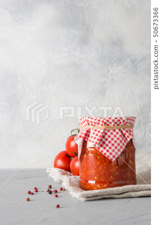 Vegetable sauce adjika with tomatoes, garlic. Vegetable sauce adjika with tomatoes, garlic. 50673366