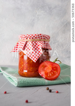 Vegetable sauce adjika with tomatoes, garlic. Vegetable sauce adjika with tomatoes, garlic. 50673368