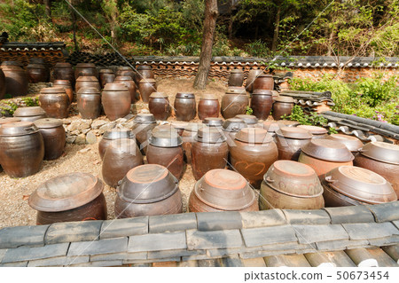 Enchanted landscape full of pots 50673454