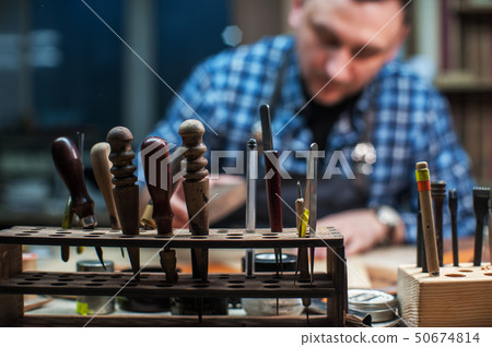 Concept of handmade craft production of leather goods. 50674814