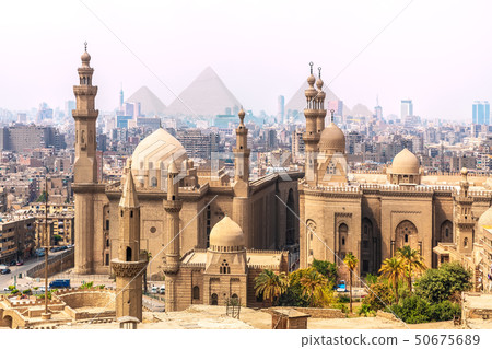 The Mosque-Madrassa of Sultan Hassan and the Pyramids in the background, Cairo, Egypt 50675689