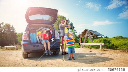Family resting in nature at sunset 50676136