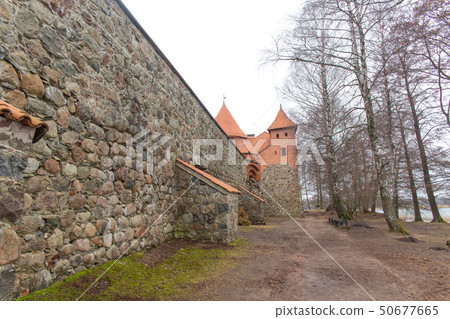 Tower and wall of the castle 50677665