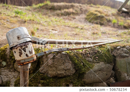 Scoop for drawing clean cold water from natural spring. 50678234