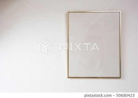 Blank painting on white wall with golden frame, space for text Blank painting on white wall with golden frame, space for text 50680423