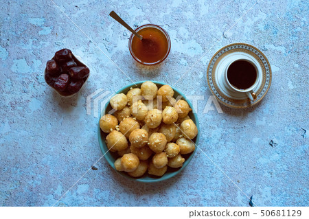 Traditional Greek sweets Loukoumades from dough Traditional Greek sweets Loukoumades from dough 50681129